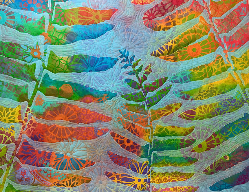 Colorful quilt with ferns on it by Susan Brubaker Knapp