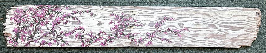 Painting of purple flowers on a white wooden board