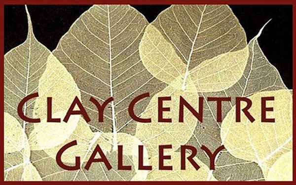 Clay Center Logo - Brown sans-serif type over photo of leaves