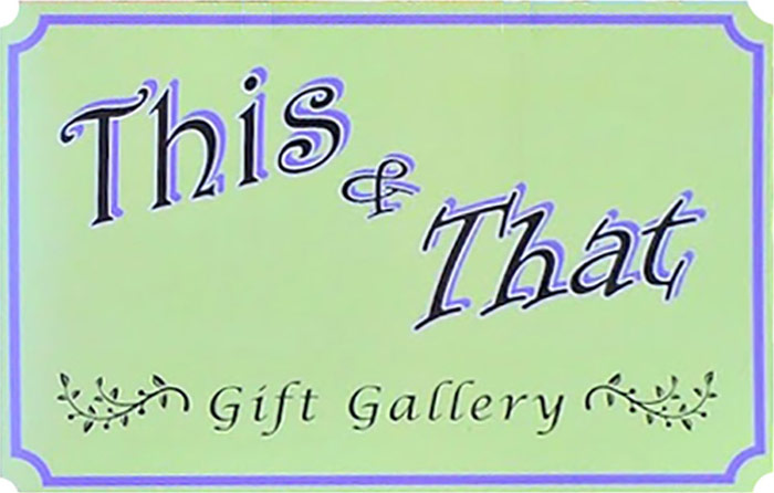 This and That Gift Gallery Logo - Black script type with purple drop shadow and border over light green background