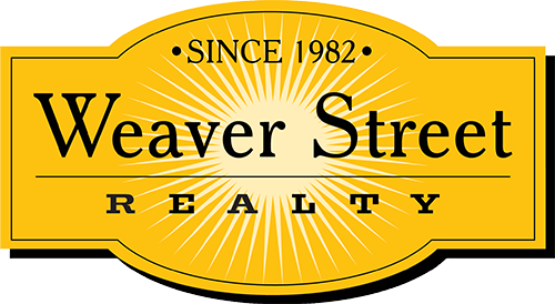 Weaver Street Realty Logo - Black serif type with light yellow burst behind over gold seal
